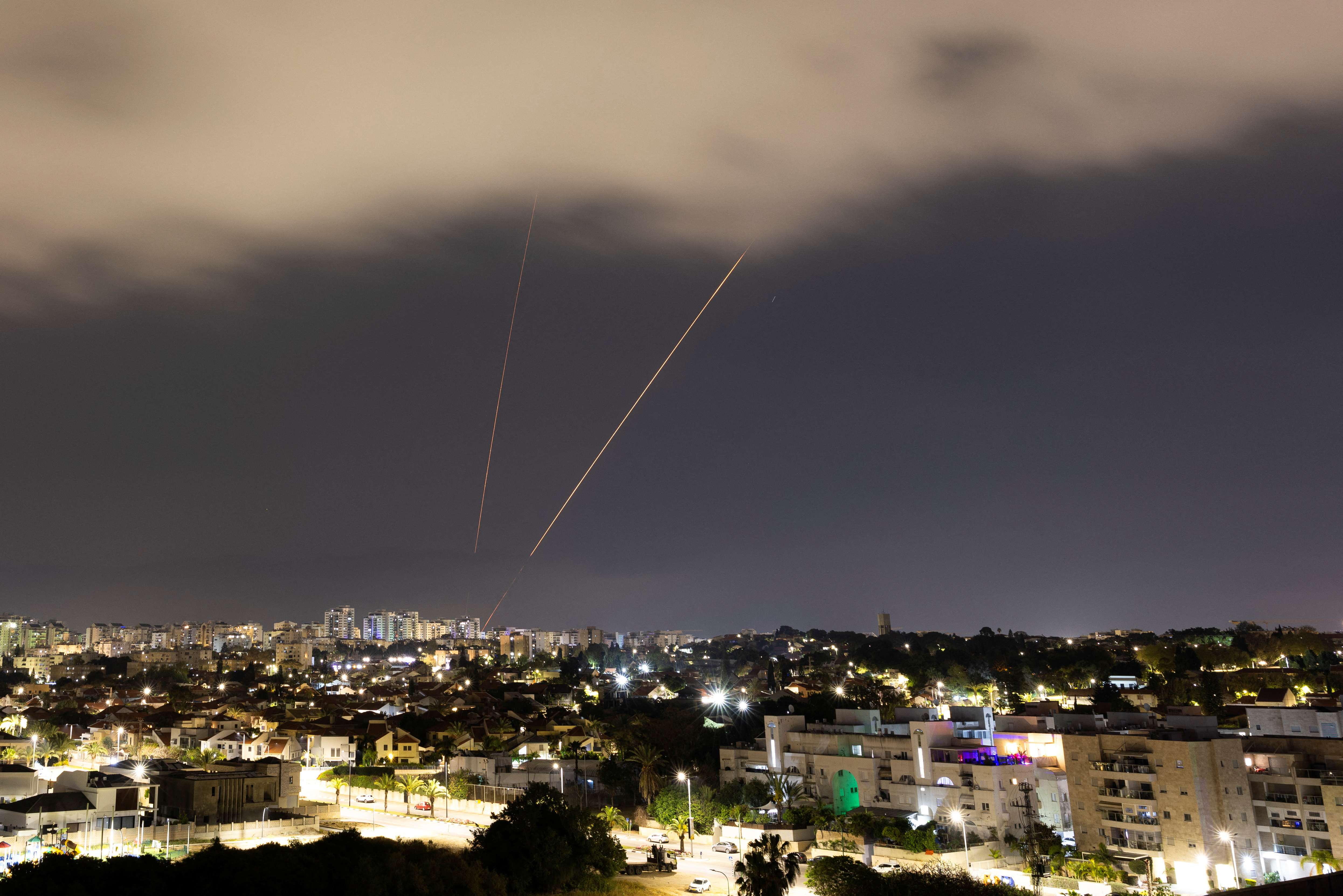 An anti-missile system operates after Iran launched drones and missiles towards Israel, as seen from Ashkelon on April 14