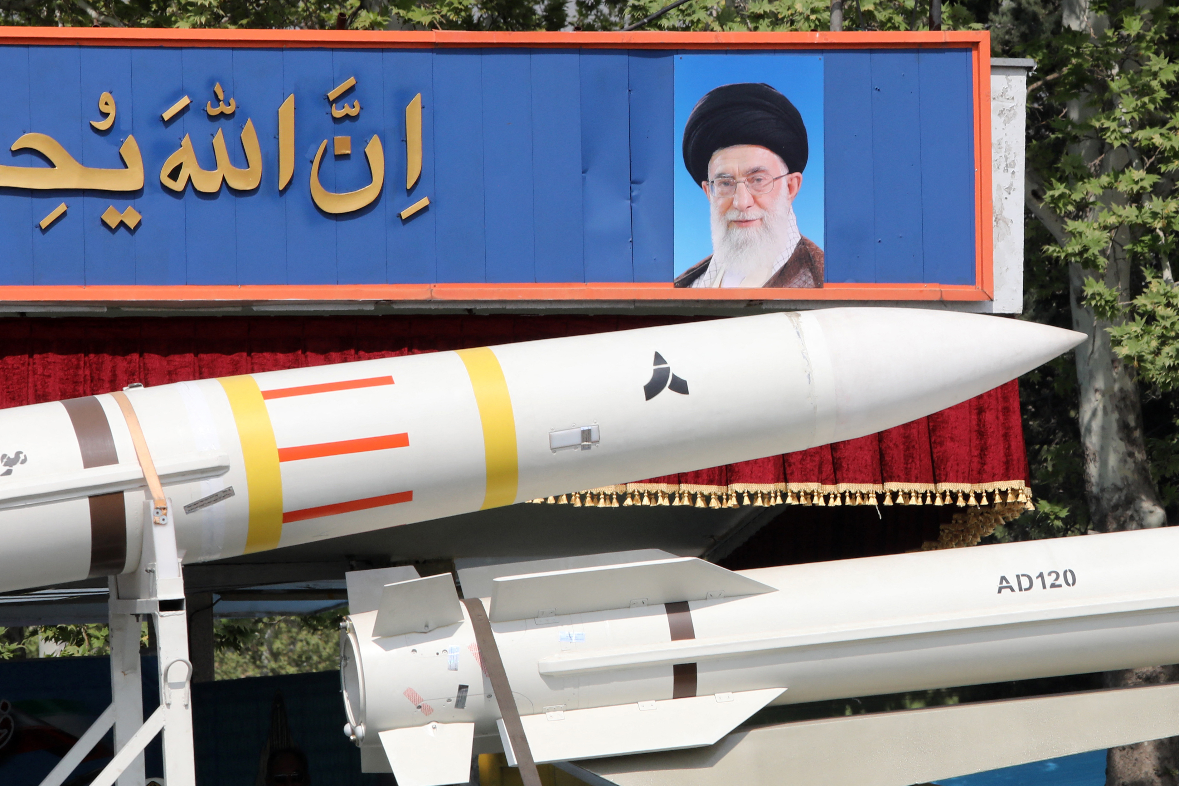 An Iranian military truck carries parts of a Sayad 4-B missile past a portrait of supreme leader Ayatollah Ali Khamenei during a military parade as part of a ceremony marking the country's annual army day in Tehran