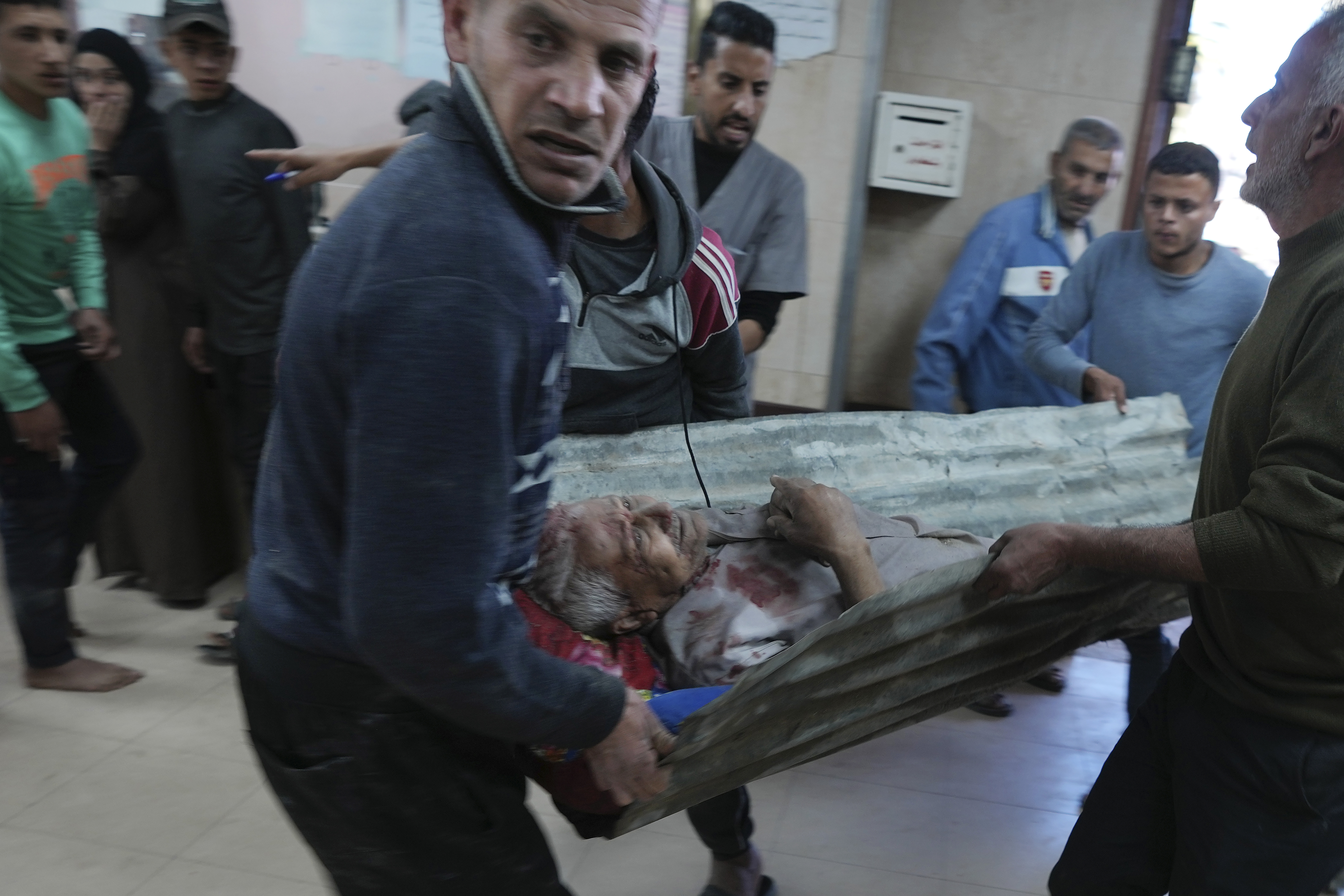 Palestinians wounded in the Israeli bombardment of the Gaza Strip are brought to Al-Aqsa Martyrs Hospital in Deir al Balah